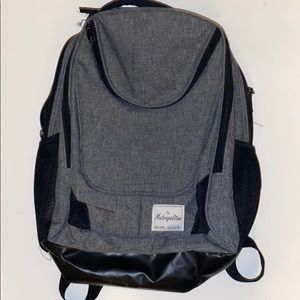 The Metropolitan grey and black backpack